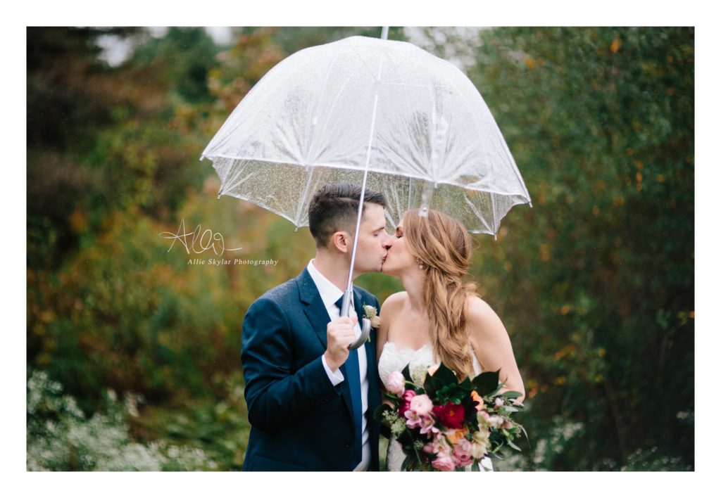 Bride and groom kiss under an umbrella on their wedding day in Berwick Pennsylvania