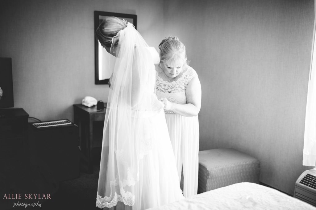 bride puts on dress in bloomsburg PA
