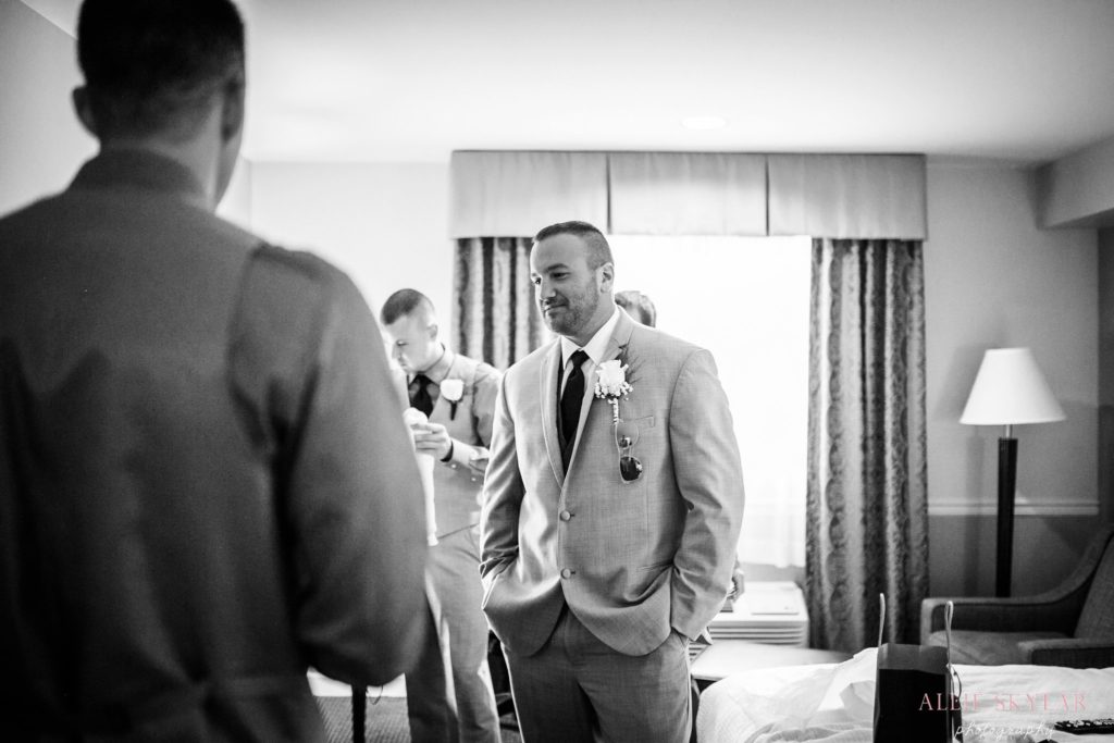 groom gets ready in his suite at the pine barn inn in danville pa