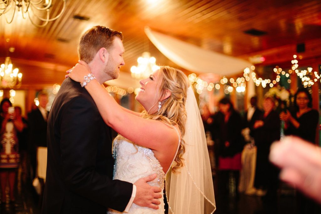 bride and groom dance their first dance under twinkling lights at stroudsmoor country inn