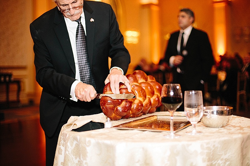 jewish wedding blessing the challah at the grove in NJ