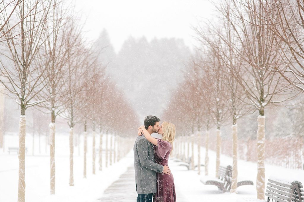 bride and groom in the snowy gardens at longwood gardens in PA
