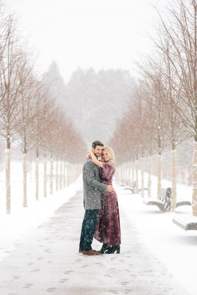 bride and groom in the snowy gardens at longwood gardens in PA
