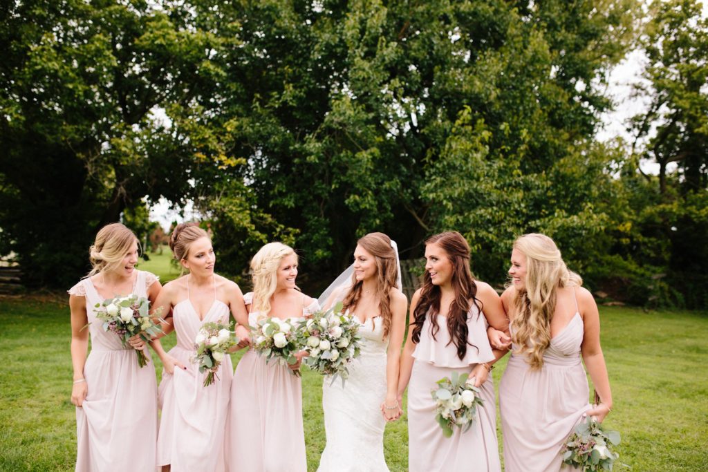 bride and bridesmaids at rose bank winery photographed by allie skylar photography