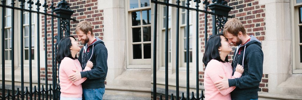 couple stroll the streets of penn university for their engagement session