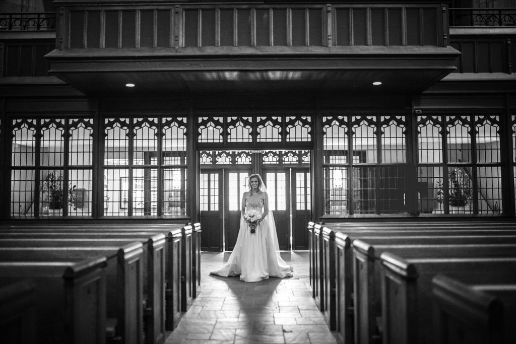 bride walks down the aisle at bryn mawr presbyterian church outside philadelphia PA