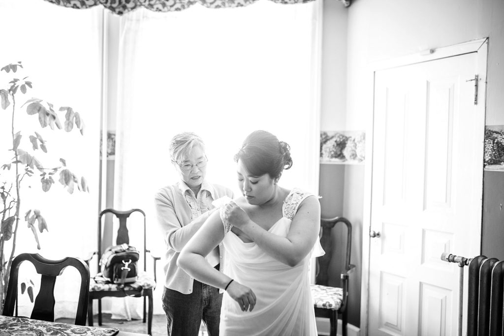 korean bride and mother embrace
