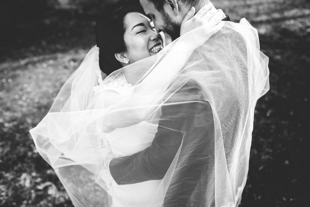 bride and groom portraits with romantic cathedral veil in fort washington PA