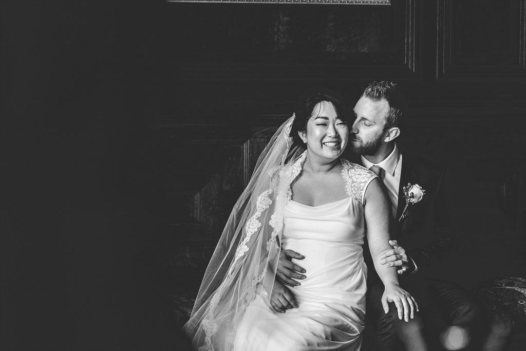 bride and groom embrace in romantic old house in fort washington PA