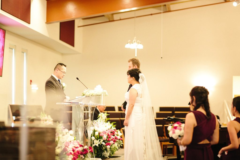 bride and groom are married in a korean american wedding at first korean Presbyterian church of Philadelphia