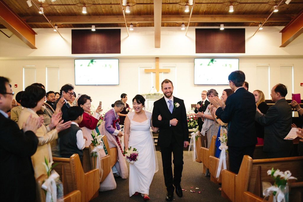 bride and groom are married in a korean american ceremony at the First Korean Presbyterian Church of Philadelphia