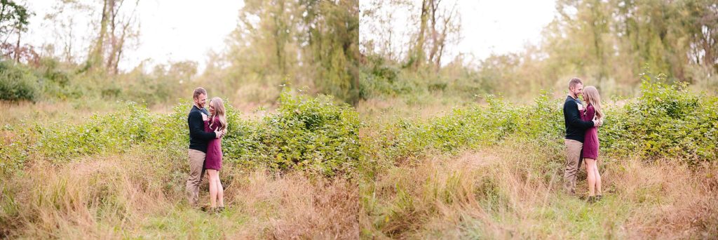couple embrace in a field at ridley creek state park for their engagement session