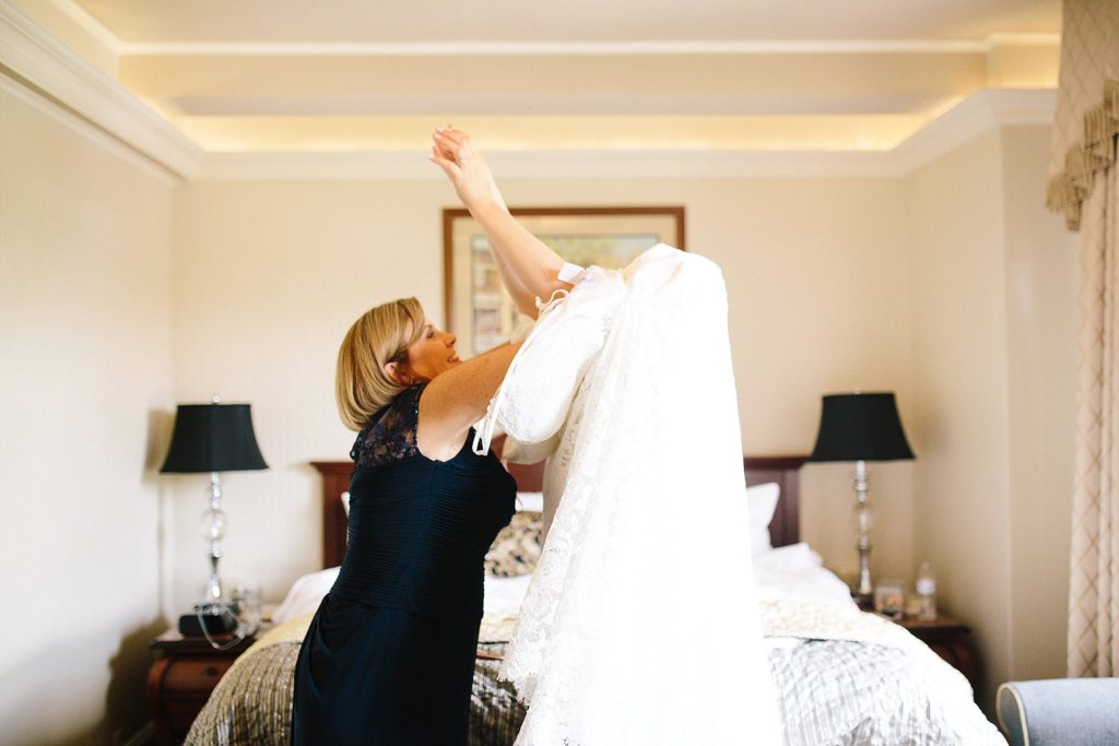 bride gets into her dress on her wedding day at the historic hotel bethlehem in lehigh valley
