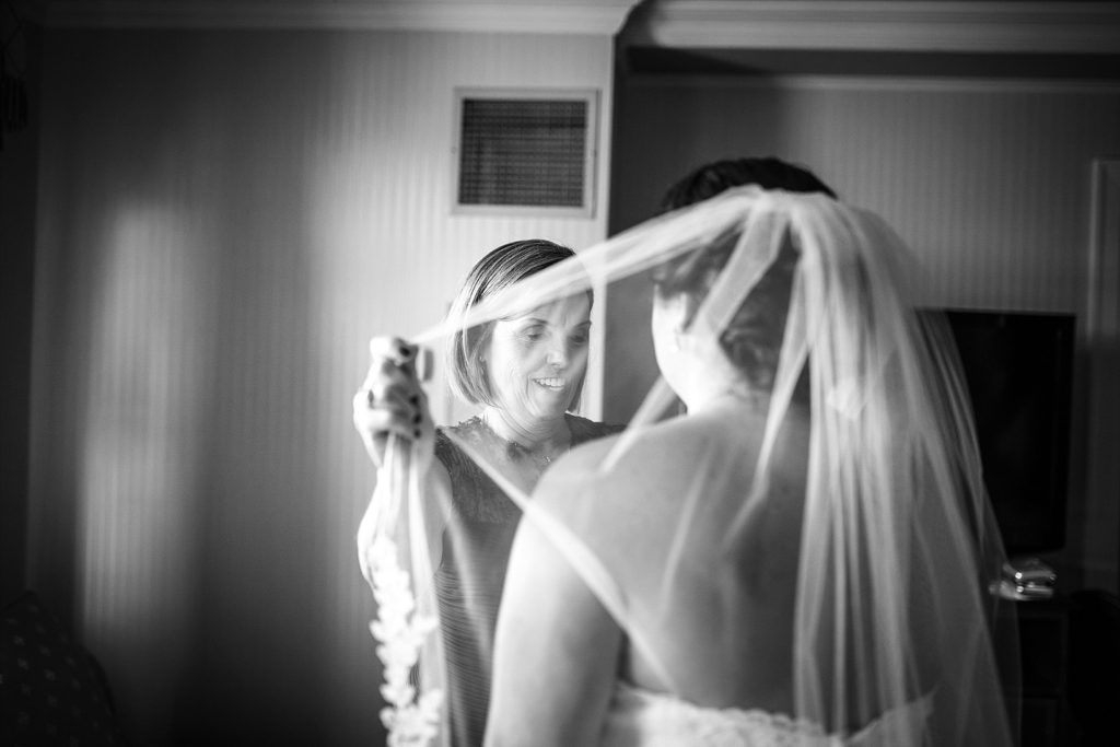 bride gets into her dress on her wedding day at the historic hotel bethlehem in lehigh valley