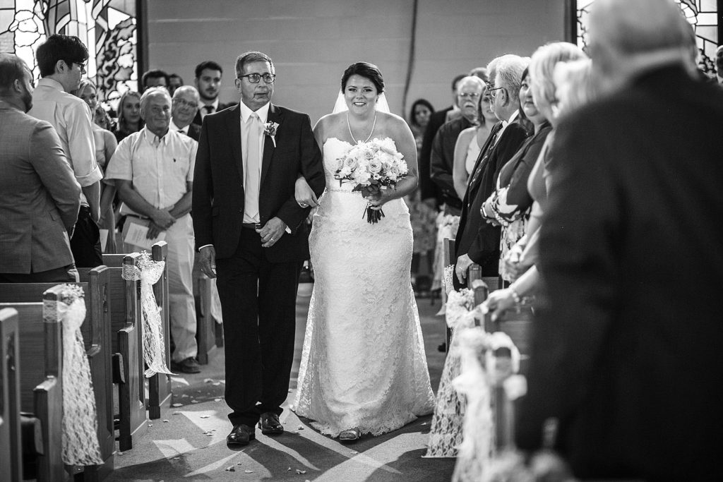 bride walks down the aisle at her wedding in lehigh valley