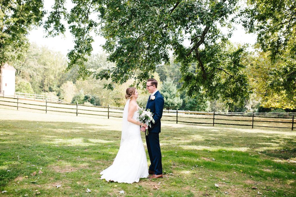 Beautiful first look between the bride and groom at Grace Winery