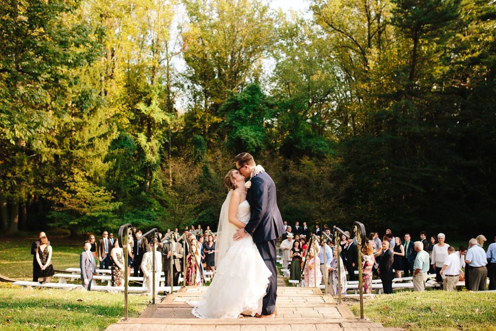 bride and groom exchange vows at their outdoor ceremony at Grace Winery in Glen Mills, PA