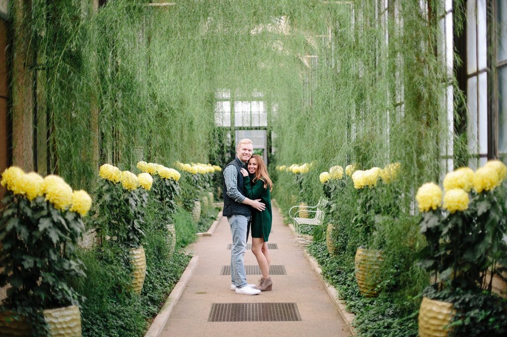 engaged couple celebrate at longwood gardens during their engagement session