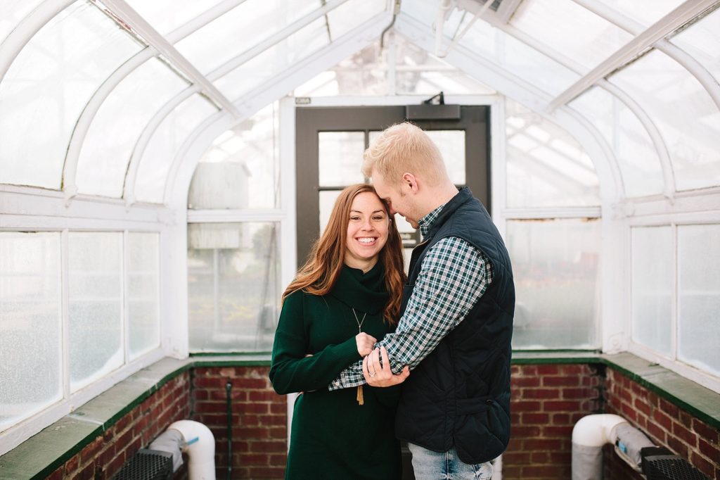 engaged couple pose at longwood gardens during their engagement session