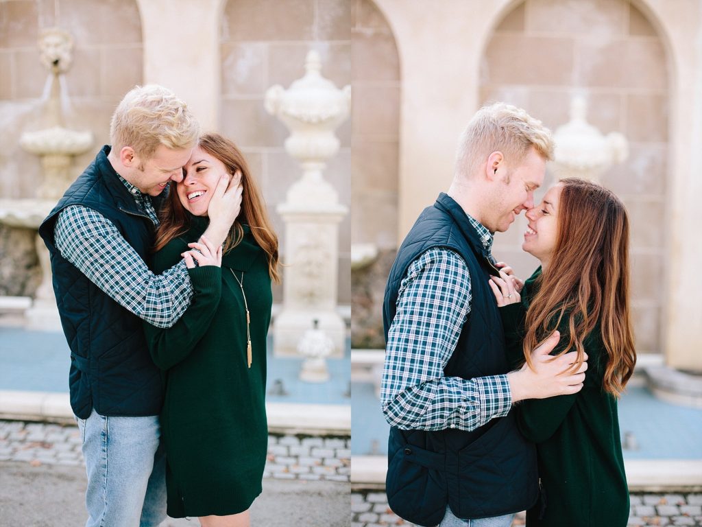 engaged couple pose by the fountains at longwood gardens during their engagement session