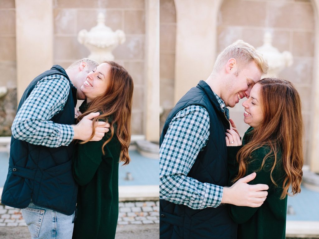engaged couple pose by the fountains at longwood gardens during their engagement session