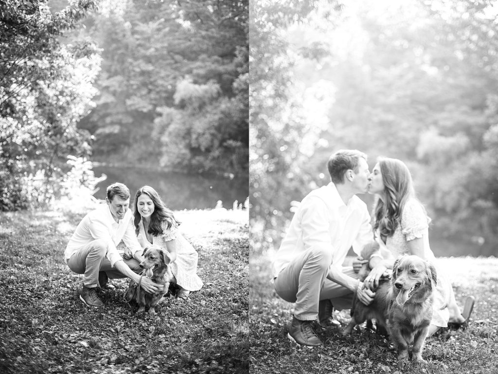 couple kiss with their dog during their engagement session at Jacobsburg Park in Lehigh Valley