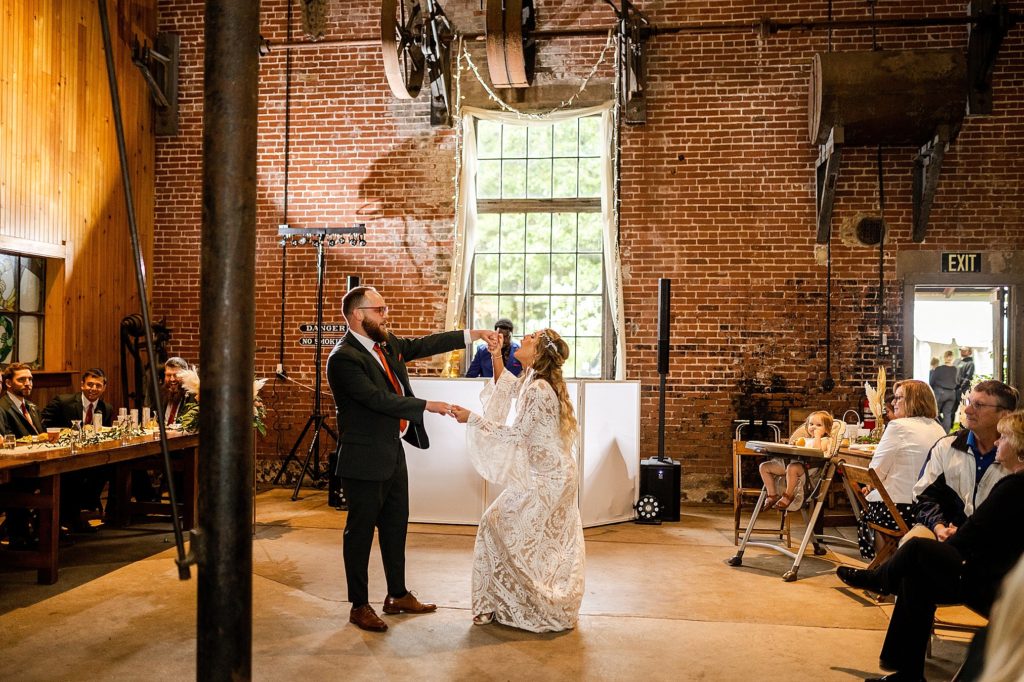 bride and groom share their first dance at their boho Pump House B&B wedding in Bloomsburg PA