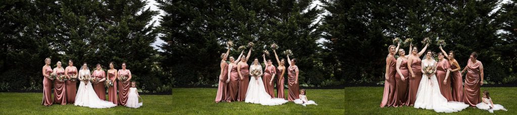 bride poses with her bridesmaids at the barn at boones dam
