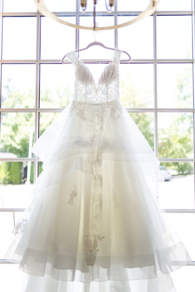 Bride's dress hangs in the window at William Penn Inn