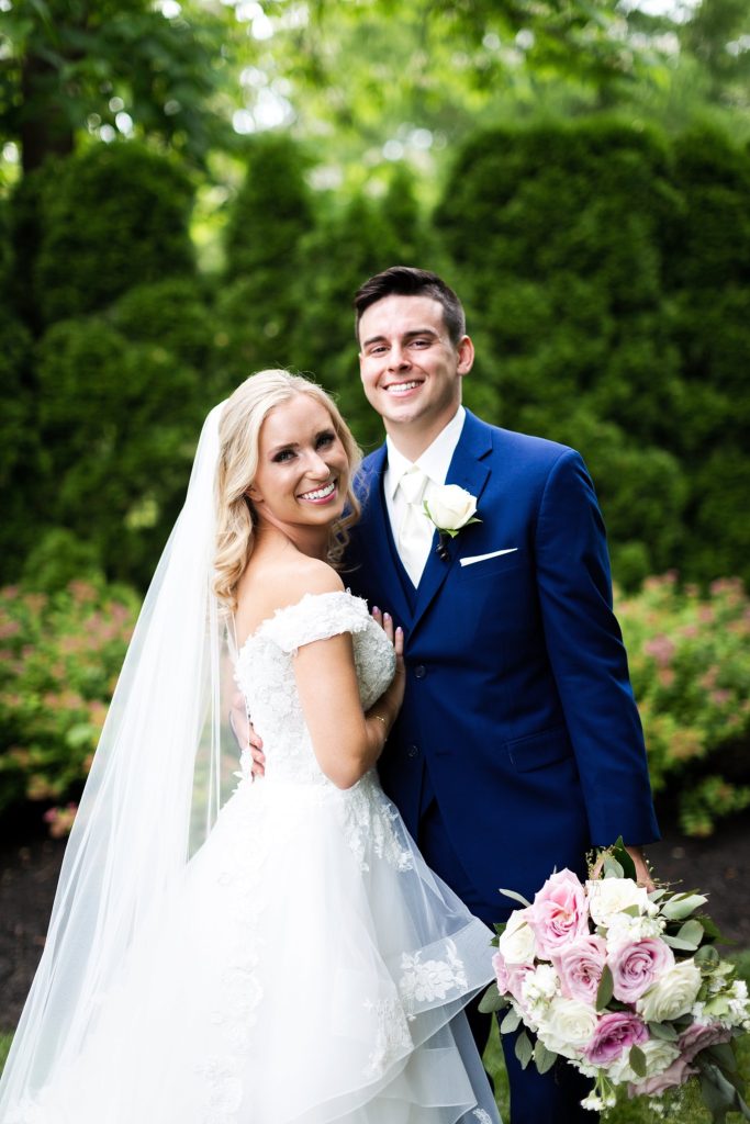 bride and groom smile during their portrait session at the William Penn Inn located in Montgomery county